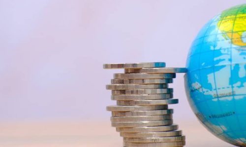 Stack of coin on table background and saving money concept
