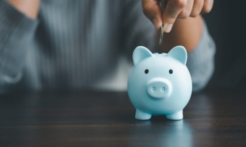 Saving investment banking finance concept. Stack of coins with piggy bank on the table. Growth of loan and investment business idea. Asset Management, Funds, Liabilities, Deposits, Income, Successful.