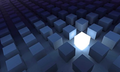 3D rendered illustration of an illuminated cube surrounded by a crowd of dark cubes: A metaphor for inspiration and unique talent